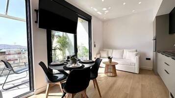 Deluxe Apartment, Private Bathroom, Harbour View | Living area | Flat-screen TV