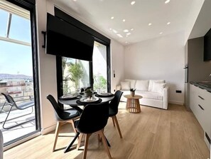 Deluxe Apartment, Private Bathroom, Harbor View | Living area | Flat-screen TV - BlueMotion - CentralSuite (Piraeus)