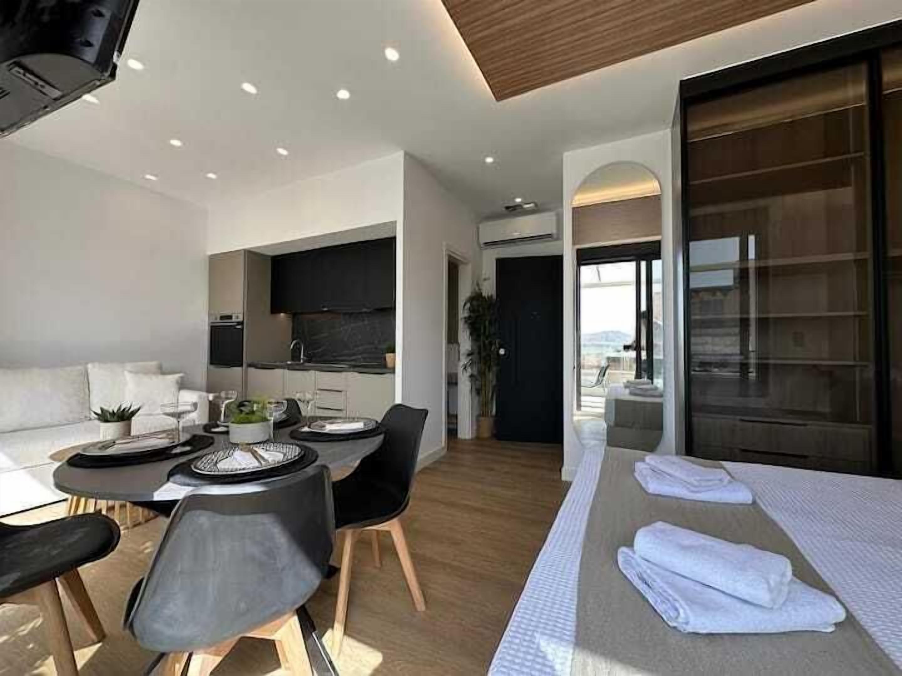 Deluxe Apartment, Private Bathroom, Harbour View | Living area | Flat-screen TV