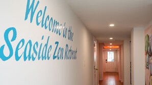 A hallway with a sign reading "Welcome to the Seaside Zen Retreat." - Seaside Zen Retreat 4-bedroom house in beautiful Seaside Heights with AC, WiFi (Seaside Heights)