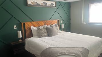 1 bedroom, desk, iron/ironing board, travel crib