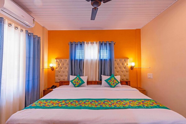 Deluxe Room | Desk, blackout drapes, iron/ironing board, rollaway beds - Treebo River View (Madikeri)