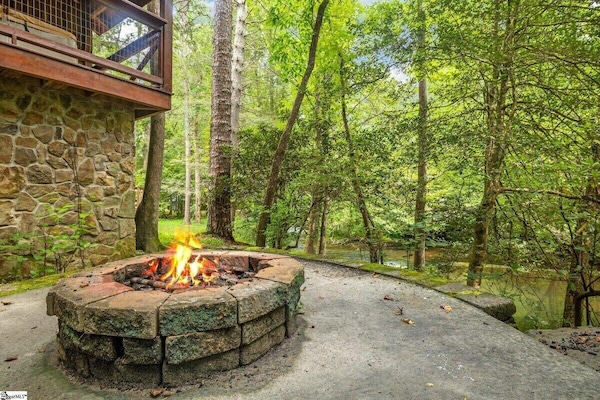 Take in the river from the fire pit while you become one with nature