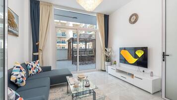 Deluxe appartement | Woonruimte | Flatscreentelevisie