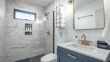 Shower, hair dryer, towels, soap