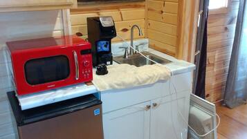 Coffee/tea maker, fridge, microwave, cookware/dishes/utensils