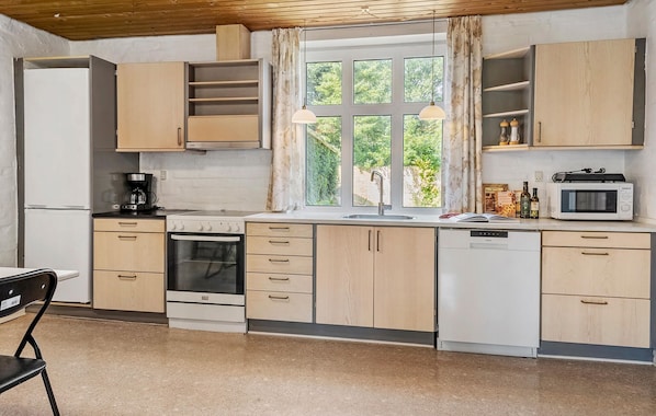 Fridge, stovetop, dishwasher, coffee/tea maker