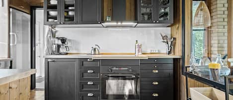 Fridge, stovetop, dishwasher, coffee/tea maker