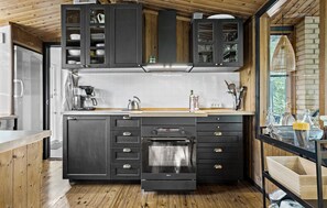 Fridge, stovetop, dishwasher, coffee/tea maker