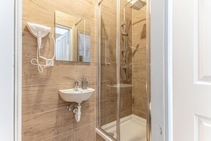 Shower, hair dryer, towels, soap