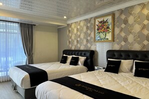 Chambre Deluxe | Bureau, lits pliants/supplémentaires, Wi-Fi gratuit, draps fournis