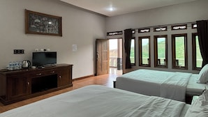 A hotel room with two beds, a TV, a cabinet, and a painting on the wall. - Puncak Darajat Highland (Cibuniherang)