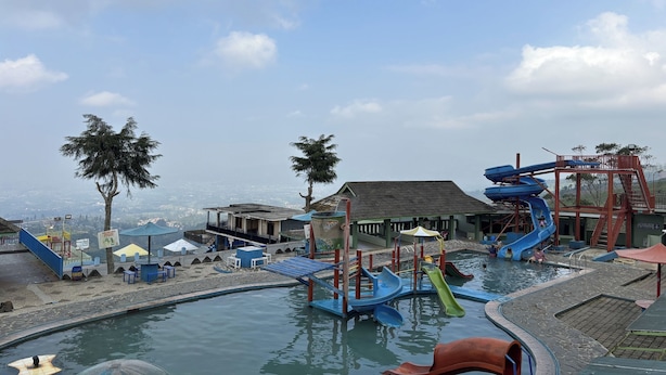 A water park with slides, a pool, and play structures. - Puncak Darajat Highland (Cibuniherang)