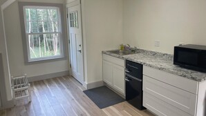 A kitchen with a window, a sink, a dishwasher, and a microwave. - Blue Hill in the Woods (Blue Hill)