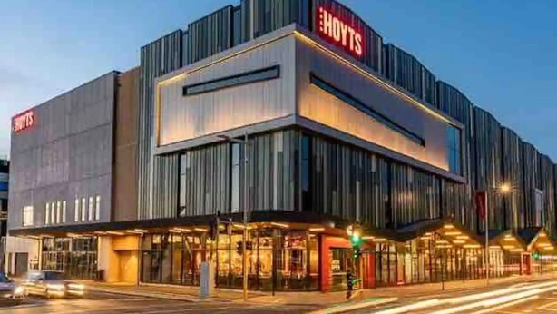 A modern hotel with a prominent 'HOTELS' sign, featuring a contemporary design with large windows and a flat roof. - 2 Bedroom Luxury apartment plus underground parking in Christchurch CBD (Christchurch)