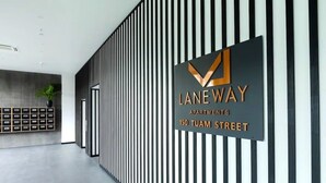 A modern hallway with a sign for Laneway Apartments at 150 Tuam Street. - 2 Bedroom Luxury apartment plus underground parking in Christchurch CBD (Christchurch)