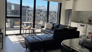 A modern apartment with a living area, dining space, and kitchen. - 2 Bedroom Luxury apartment plus underground parking in Christchurch CBD (Christchurch)
