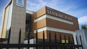 A modern hotel building with a sign that reads "Hotel Stalwart Jajati."