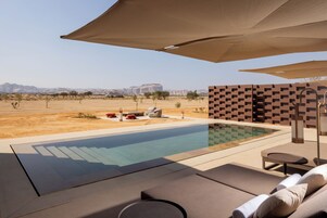 Outdoor pool, open 6:00 AM to 6:00 PM, pool umbrellas, sun loungers