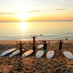 On the beach, beach towels, beach yoga, beach volleyball