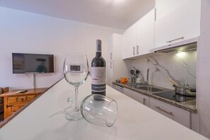 Microwave, stovetop, coffee/tea maker, dining tables
