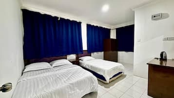 1 bedroom, desk, laptop workspace, bed sheets