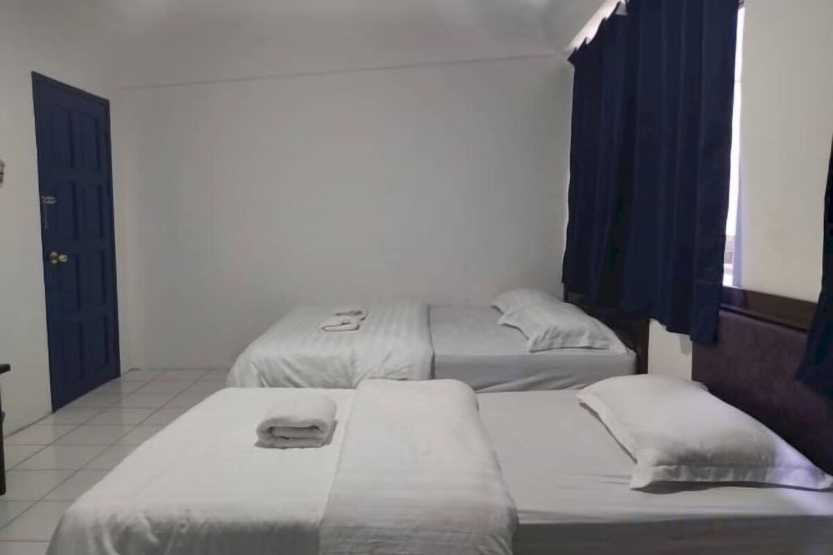 Desk, laptop workspace, bed sheets