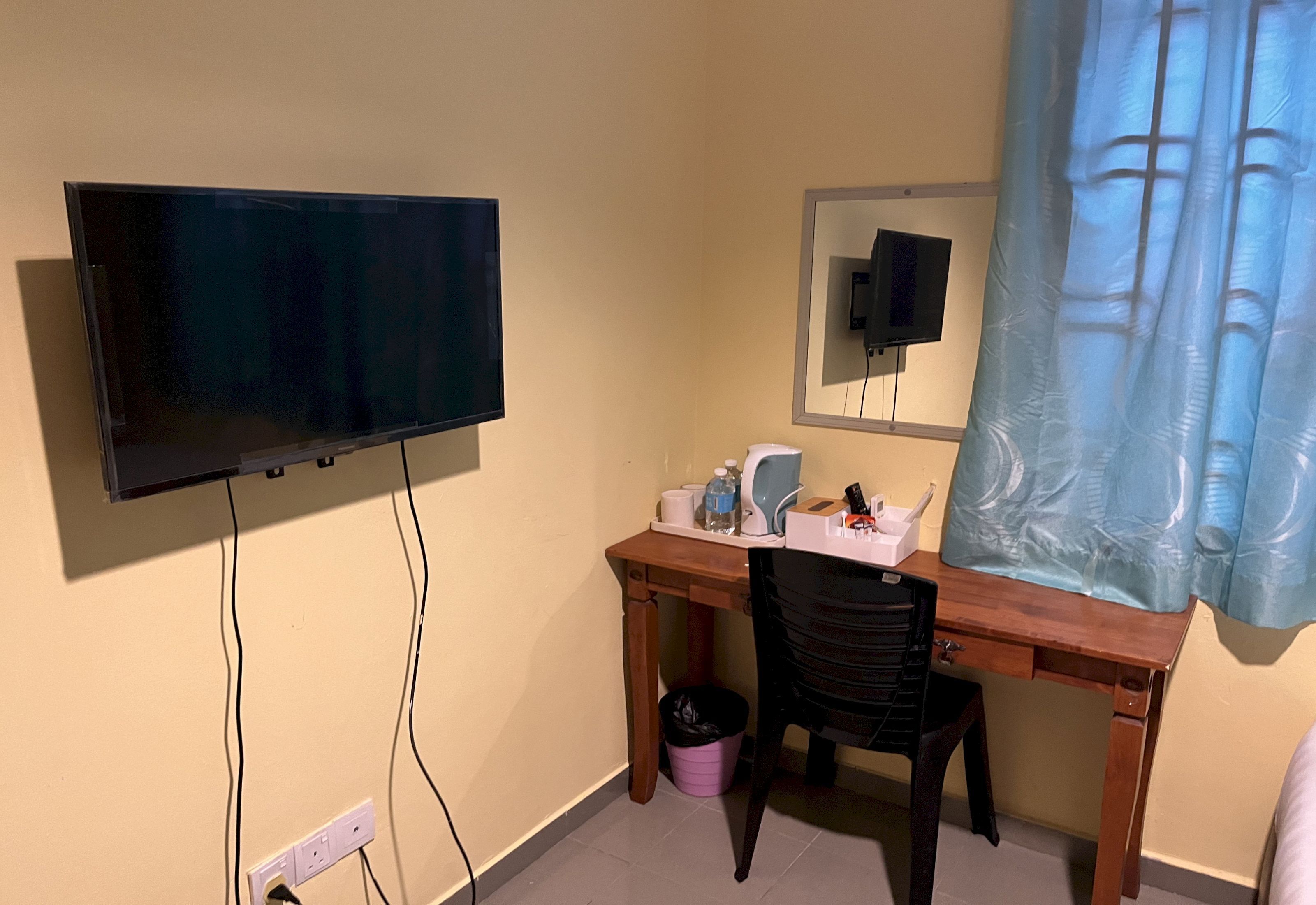 Desk, laptop workspace, bed sheets