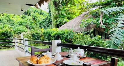 Family Studio with panoramic windows to tropical greenery. 3 min to the beach