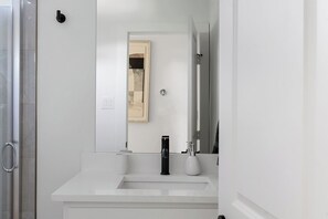 Shower, hair dryer, towels, shampoo