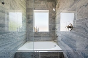 Shower, hair dryer, towels, shampoo