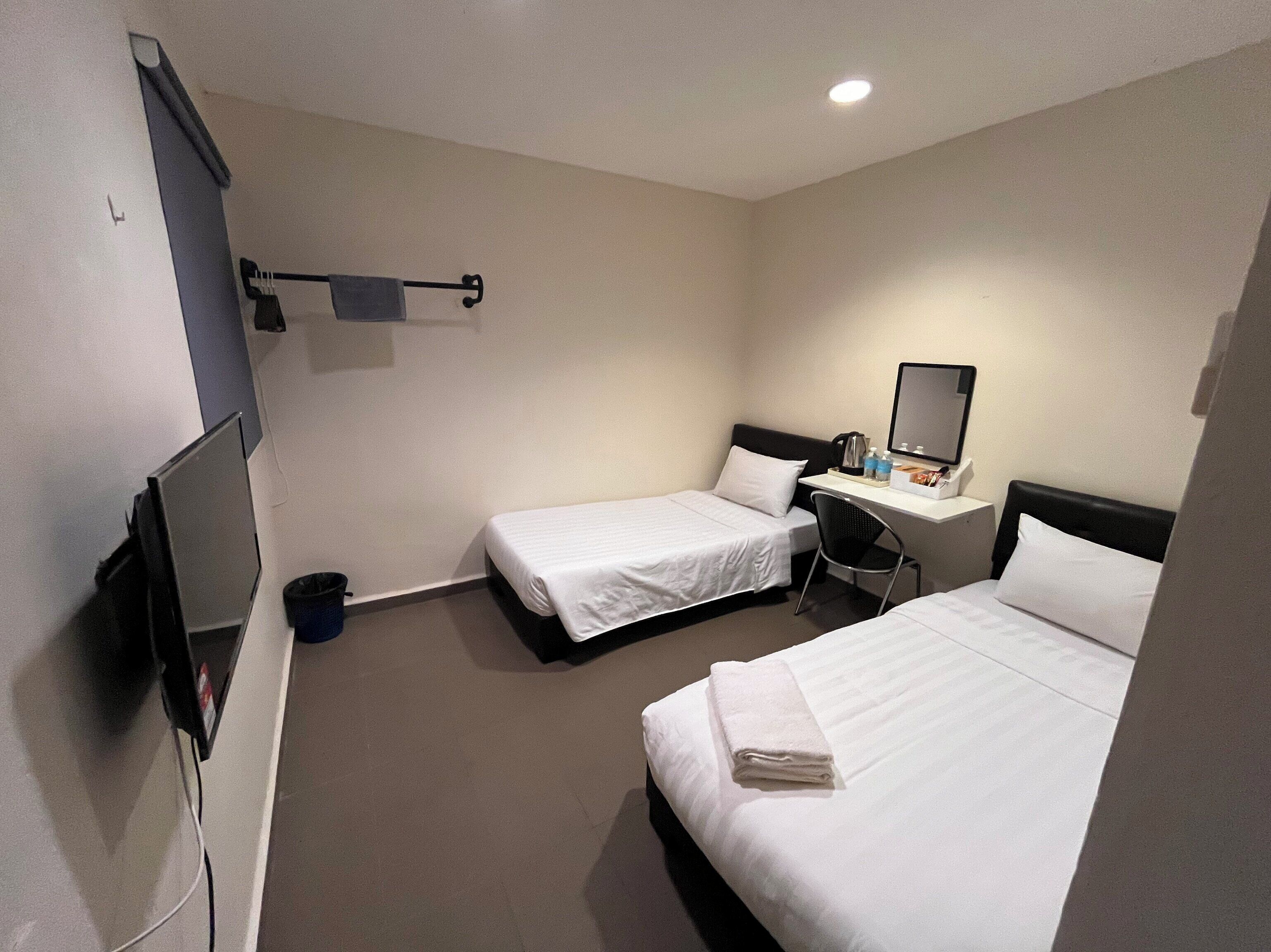 Desk, laptop workspace, bed sheets