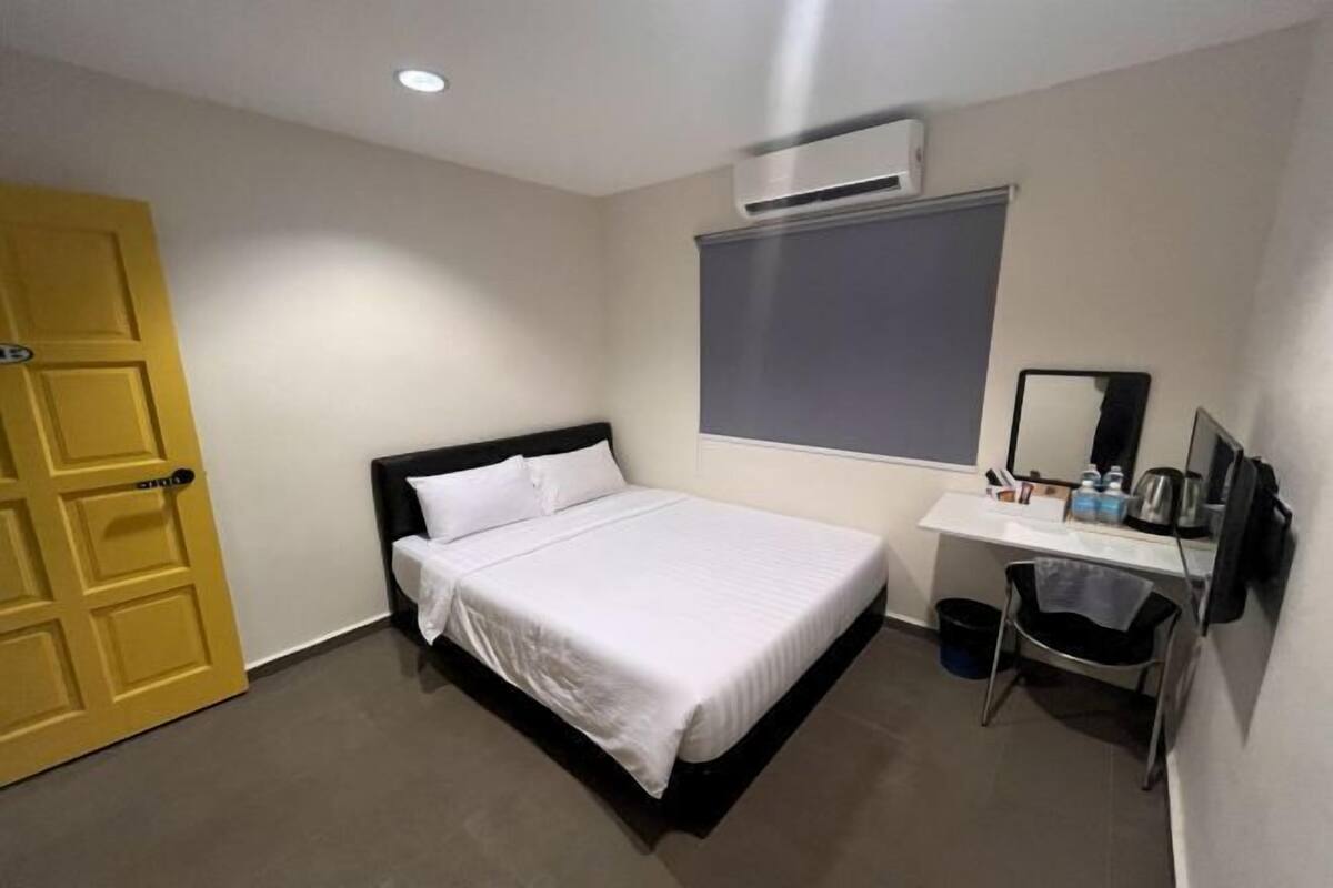Desk, laptop workspace, bed sheets