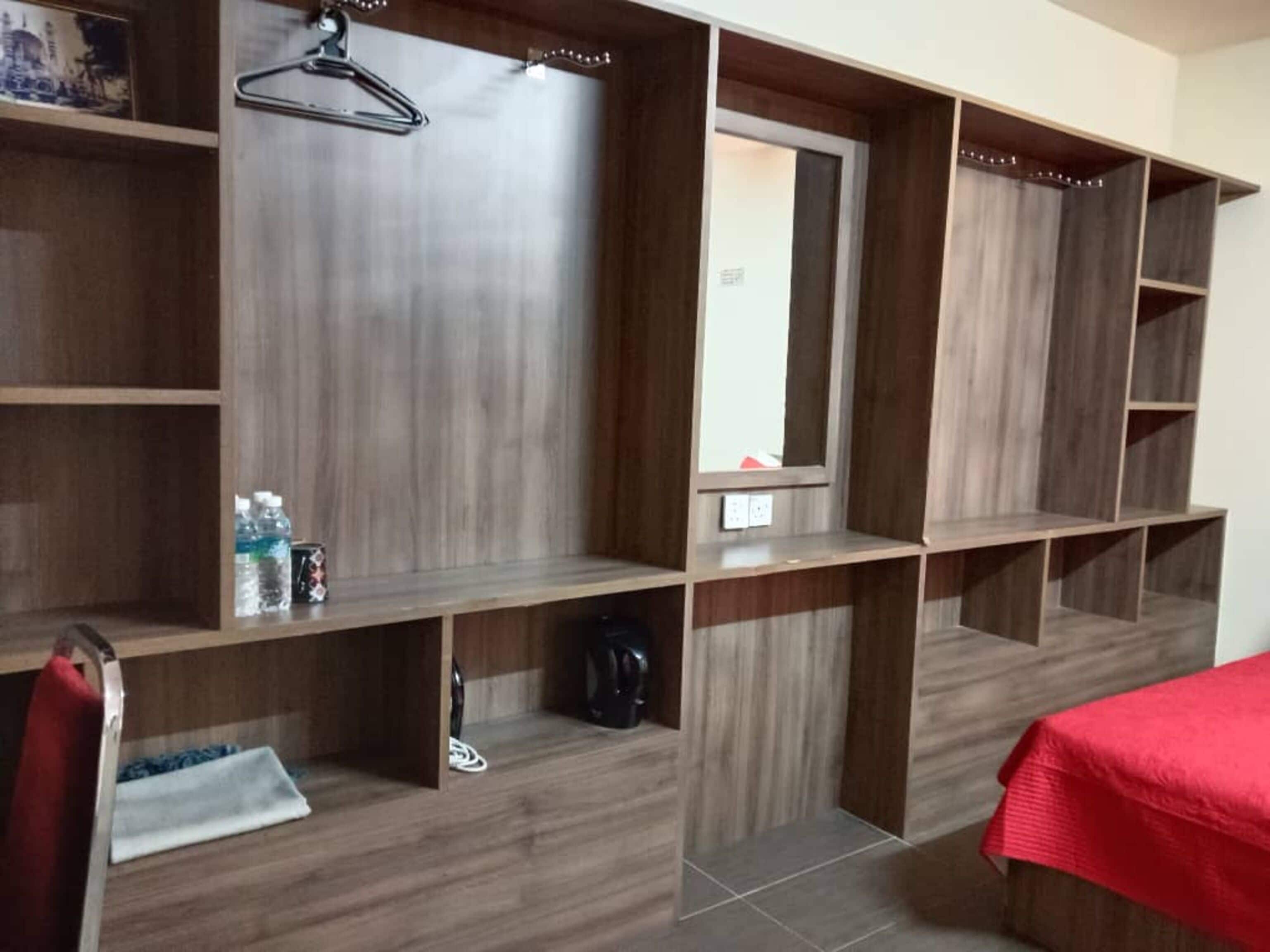 Desk, laptop workspace, bed sheets