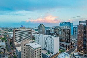 A cityscape with modern high-rise buildings, including a prominent bank. - Modern HighRise Sanctuary+Gym+Pool+Prking+W/D (Phoenix)