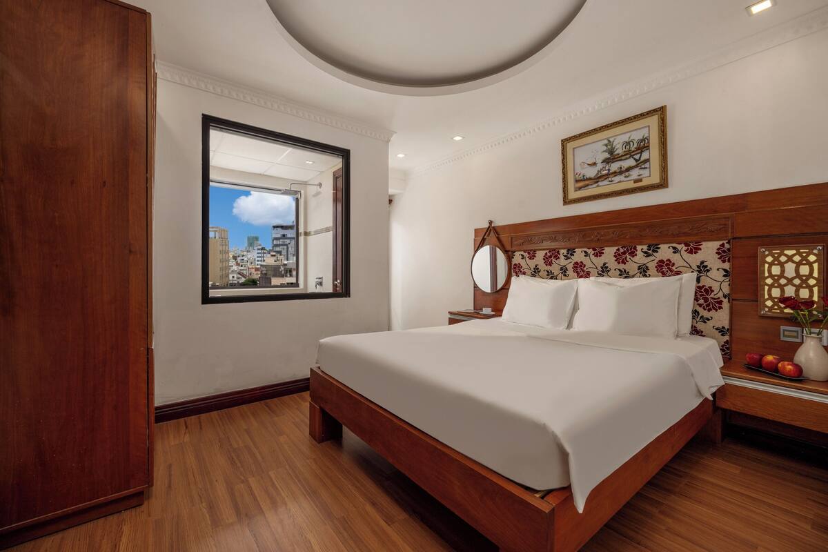 Premium bedding, desk, laptop workspace, blackout curtains