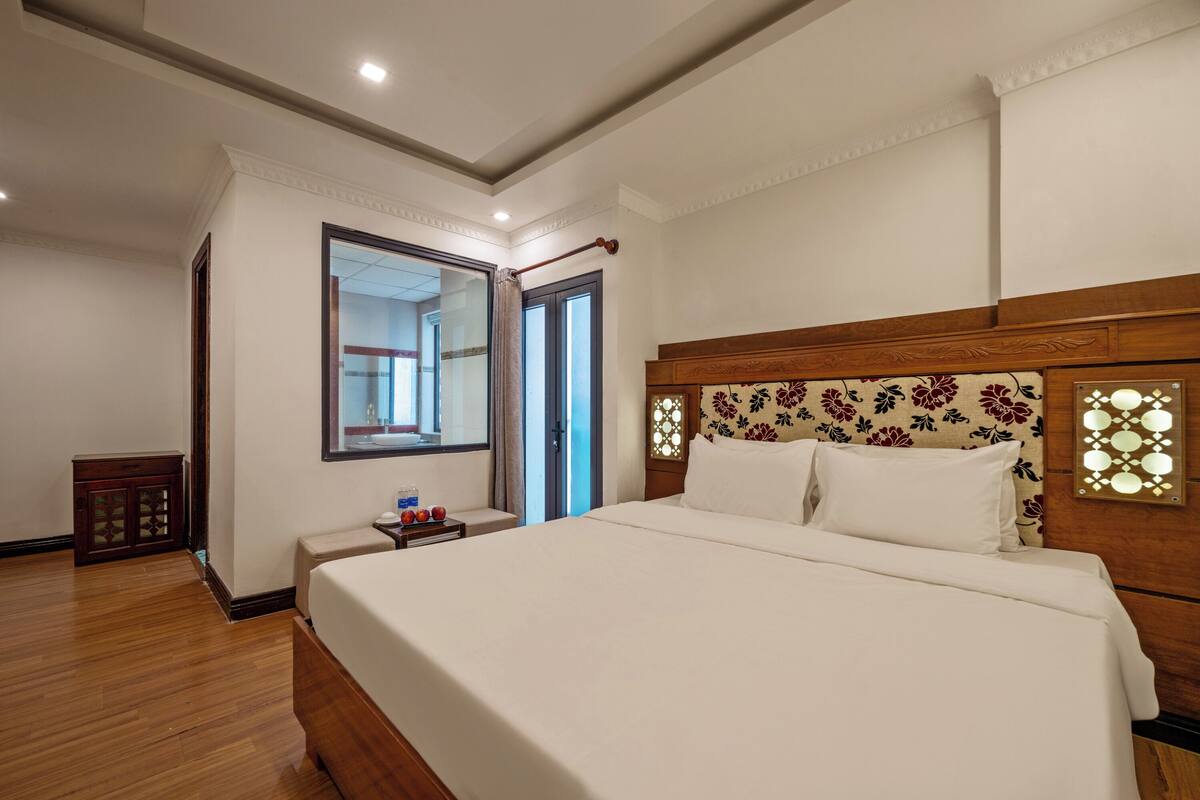 Premium bedding, desk, laptop workspace, blackout curtains