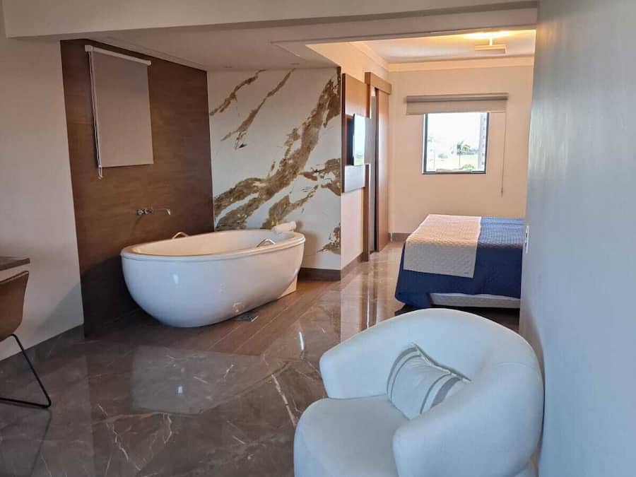 Deluxe Suite, City View | Living area | TV