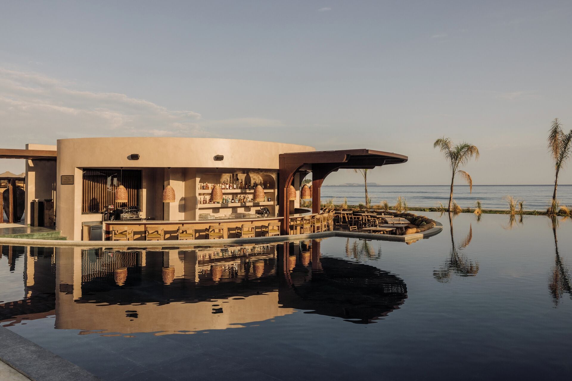A bar area with a pool reflecting the surroundings.
