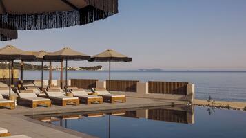 4 outdoor pools, open 10:00 AM to 6:00 PM, pool umbrellas, sun loungers