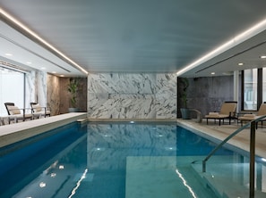 Indoor pool, outdoor pool, pool umbrellas, lifeguards on site
