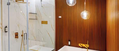 Luxury Studio Suite | Bathroom | Hair dryer, slippers, towels, soap