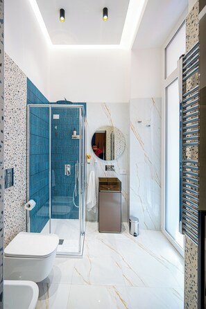 Deluxe Room, 1 King Bed, City View | Bathroom | Hair dryer, slippers, towels, soap