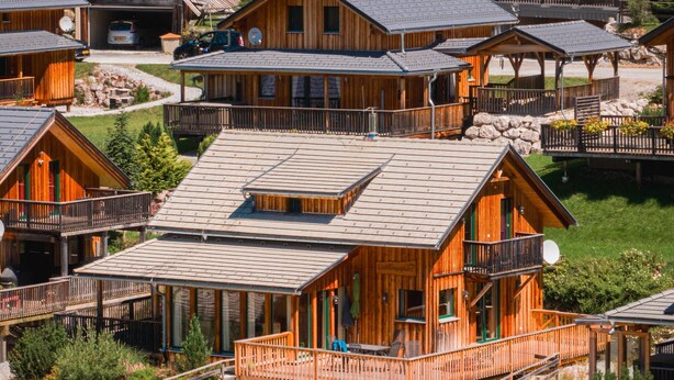 A wooden lodge with multiple balconies and a central open area. - Chalet in Hohentauern Near Ski Slopes (Hohentauern)