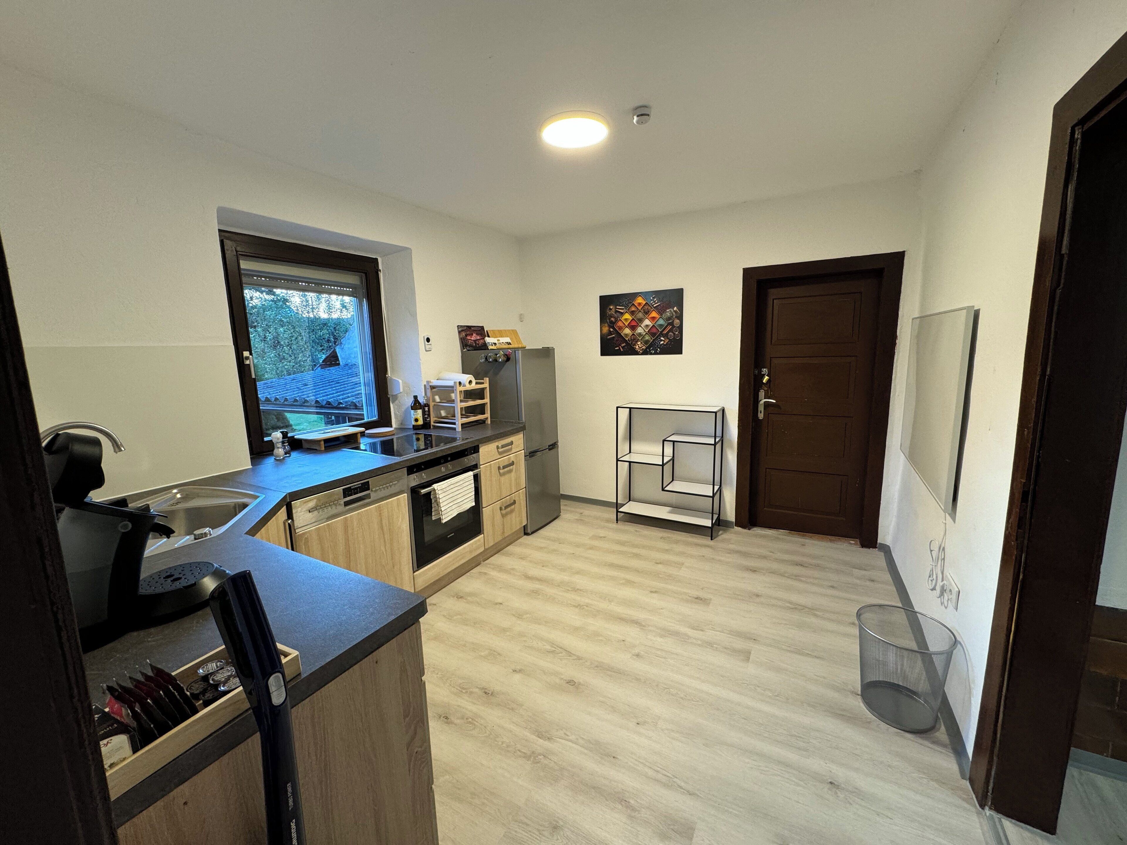 Fridge, stovetop, dishwasher, coffee/tea maker