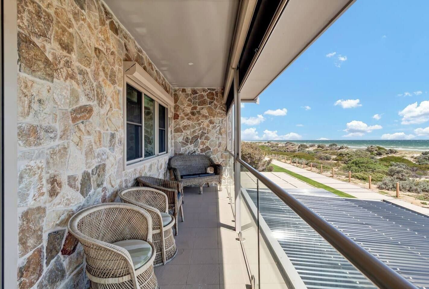 A generous balcony is the ideal spot to enjoy your morning cuppa or an afternoon glass of wine while taking in stunning ocean views and cooling sea breezes. 
