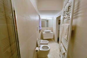 Hair dryer, bidet, towels, soap