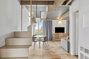 Two-Bedroom Apartment with Terrace | Living area | 50-inch flat-screen TV with cable channels - Limehome Rome Via Fortebraccio (Rome)