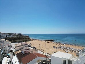 On the beach, sun-loungers