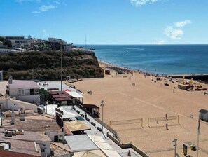 On the beach, sun-loungers